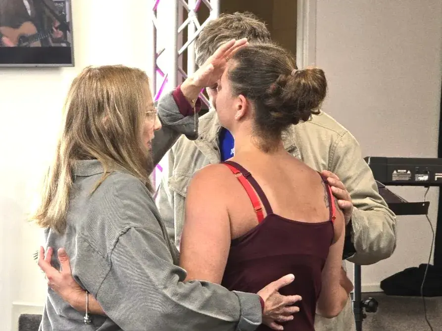 People praying together at Lifegate
